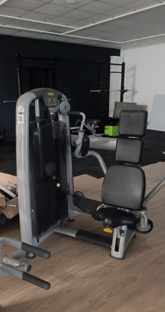 Customer receiving installed and tested fitness machines after professional relocation.